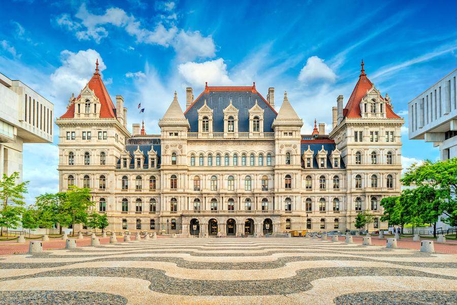 The Albany NY capitol building under blue sky.